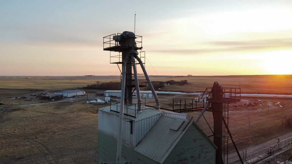 Steel grain leg installed in place of the old wooden leg, shown at sunset