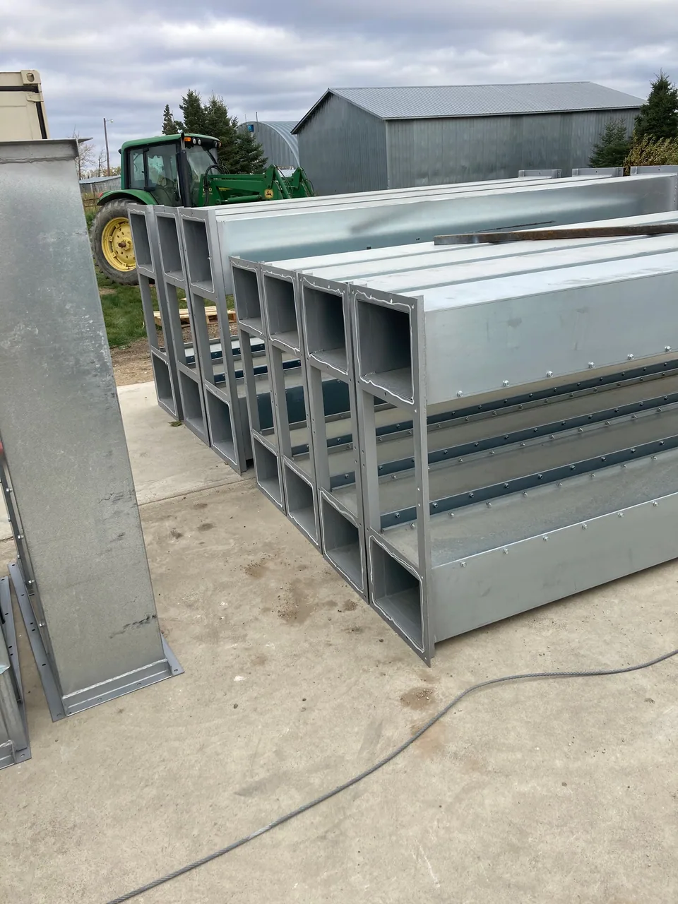 Dryer-feed conveying equipment and tower sections