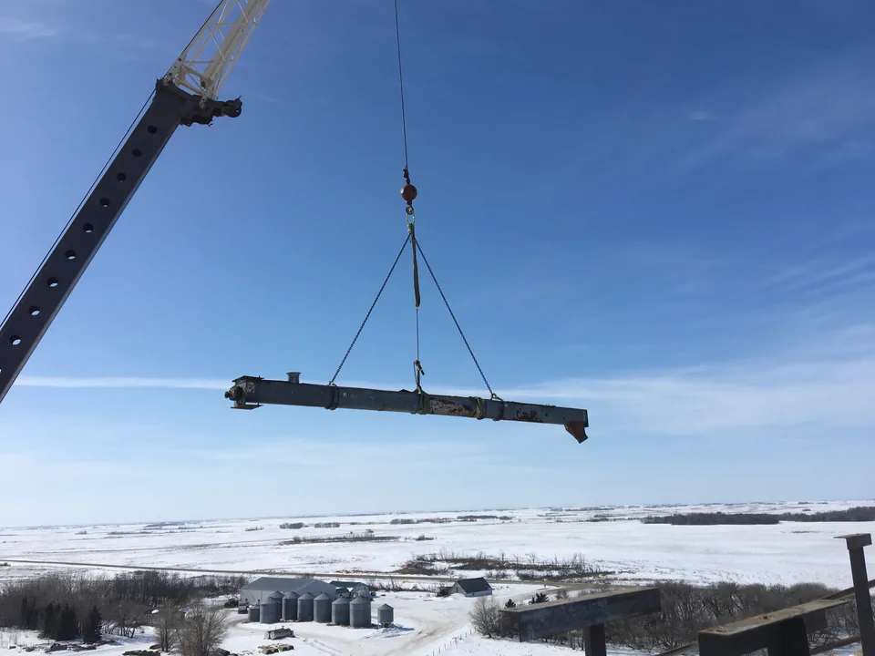Crane-supported conveyor work above the silos