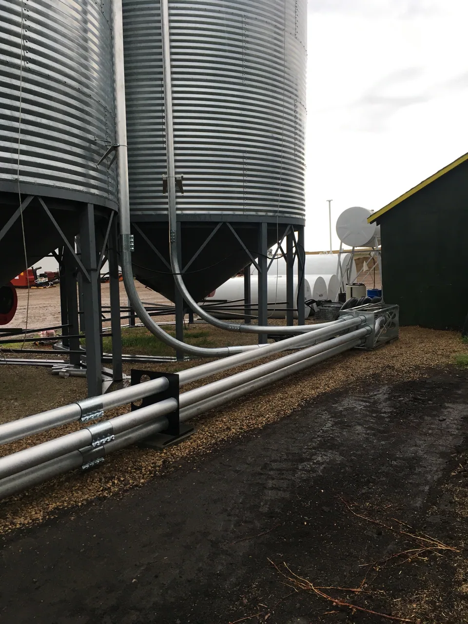 Blower piping and elbows fitted along the bins