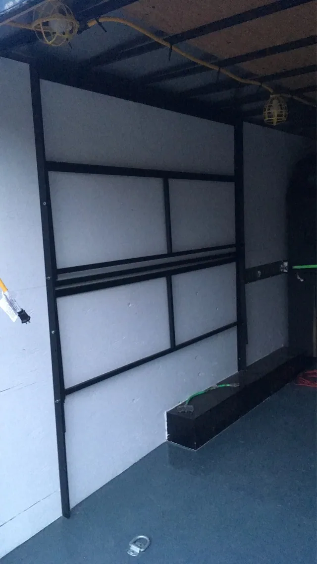 Fold-down table frames folded against the wall