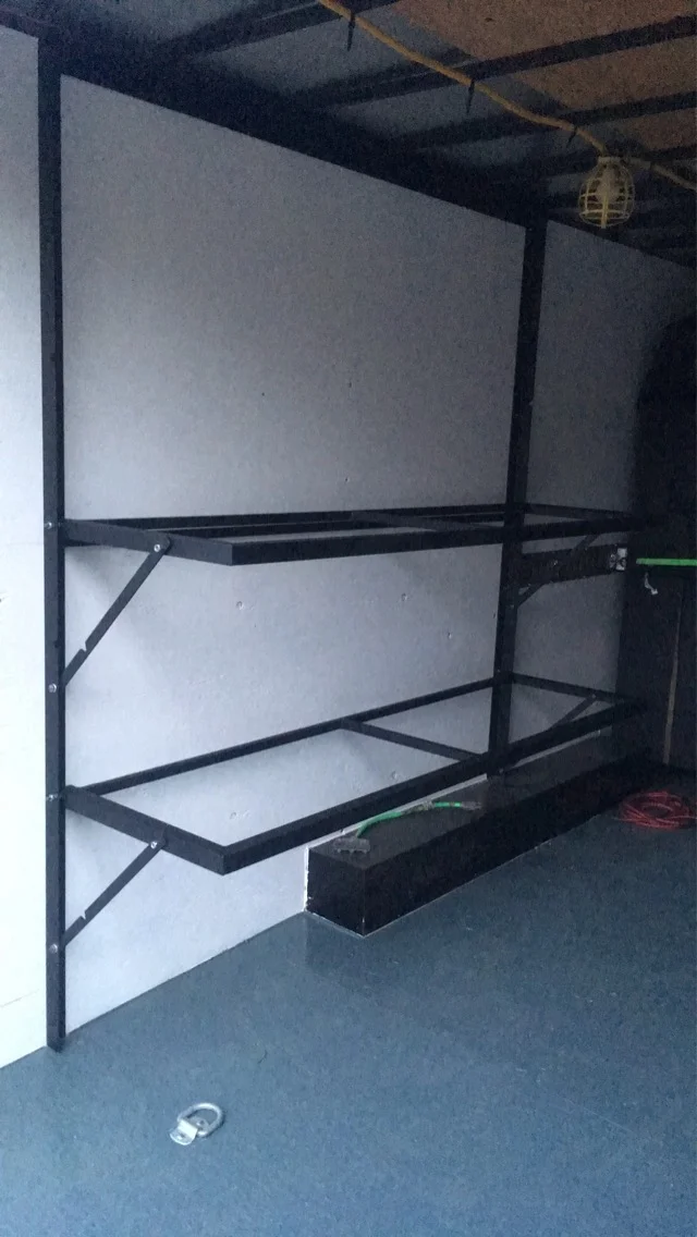 Fold-down table frames in the lowered position