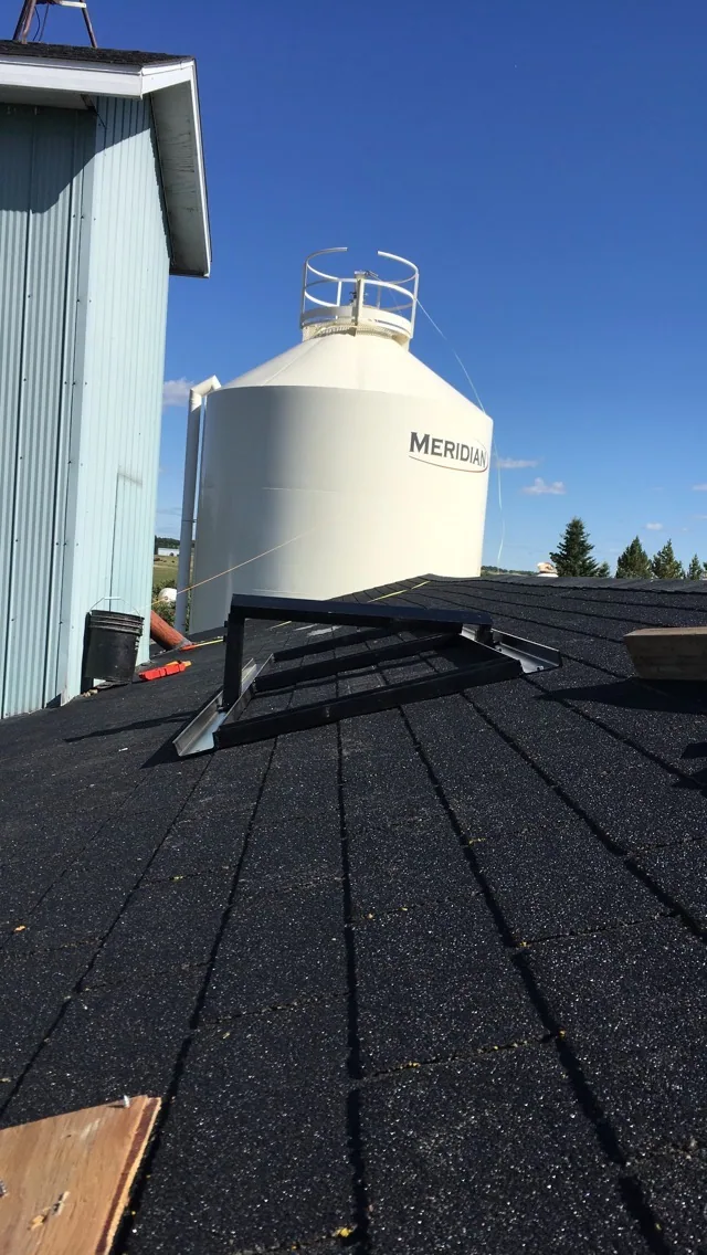 Steel supports fitted around a roof opening