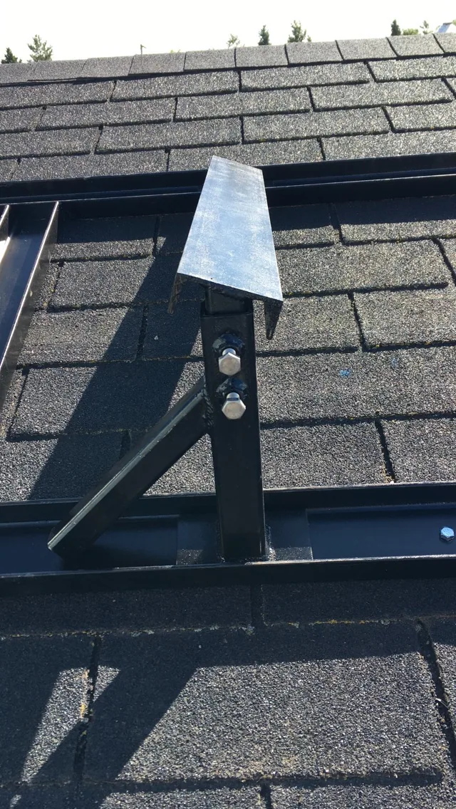 Steel supports fitted around a roof opening