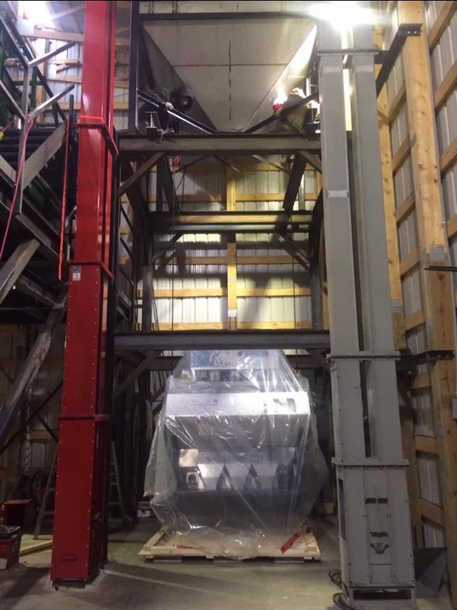 Colour sorter and small bucket elevator inside the building