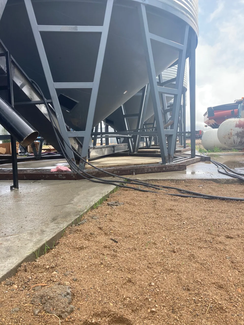 Blower equipment and grain piping beneath the bins